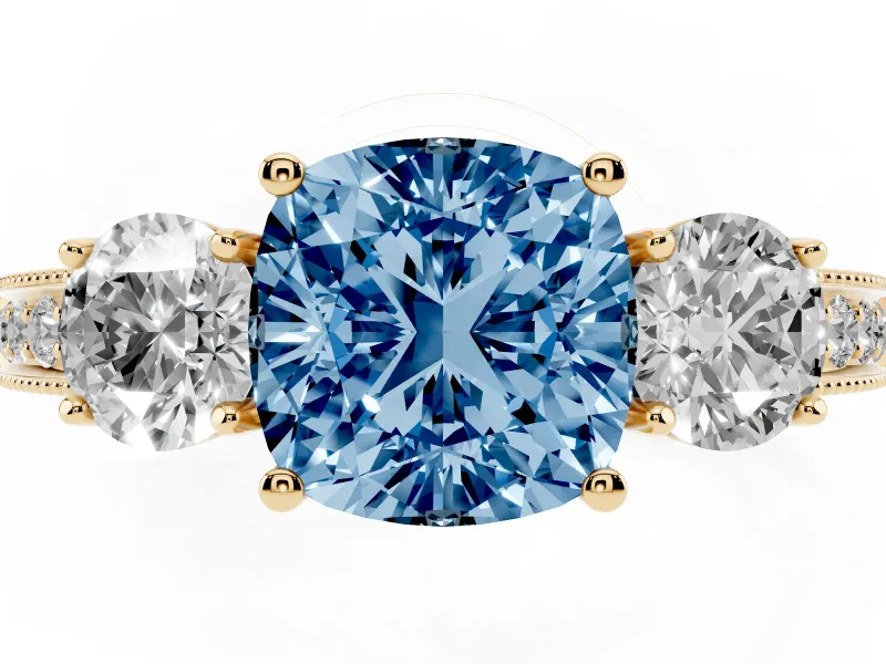 Fancy Blue Cushion Cut Diamond Three-Stone Ring Set in Yellow gold with Round Side Stones and Pavé Band