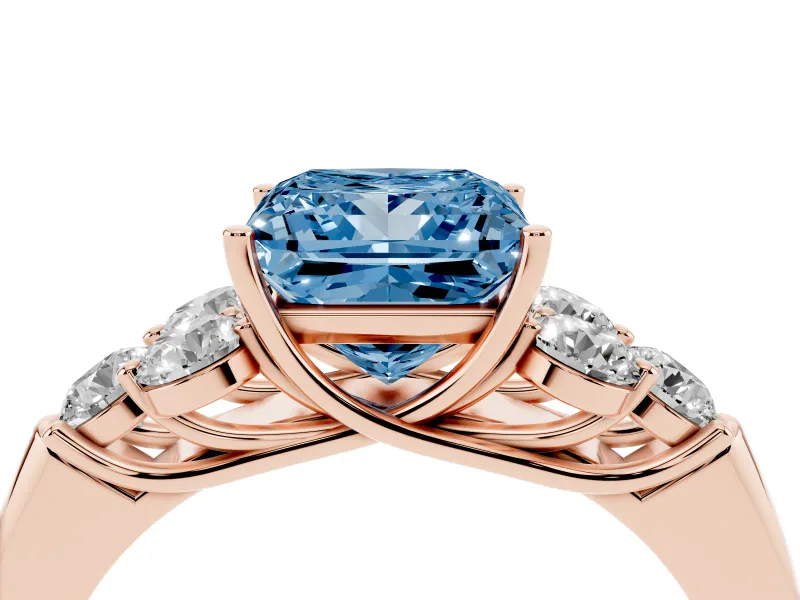 Fancy Blue Princess Cut Diamond Cluster Ring Set in Rose gold with Round Accent Stones and Prong Setting on a Plain Band