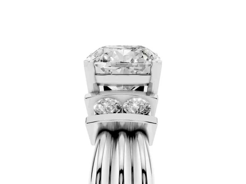 Three-Stone Cushion Cut Diamond Channel Set Ring Set in Platinum with Bar Prongs