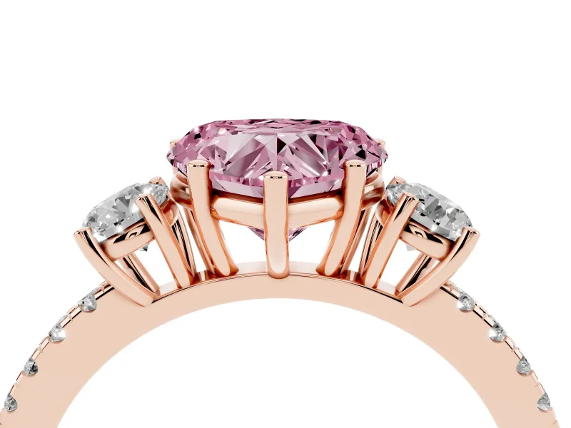 Fancy Pink Heart Cut Diamond Three-Stone Ring Set in Rose gold with Pavé Band and Graduated Sides
