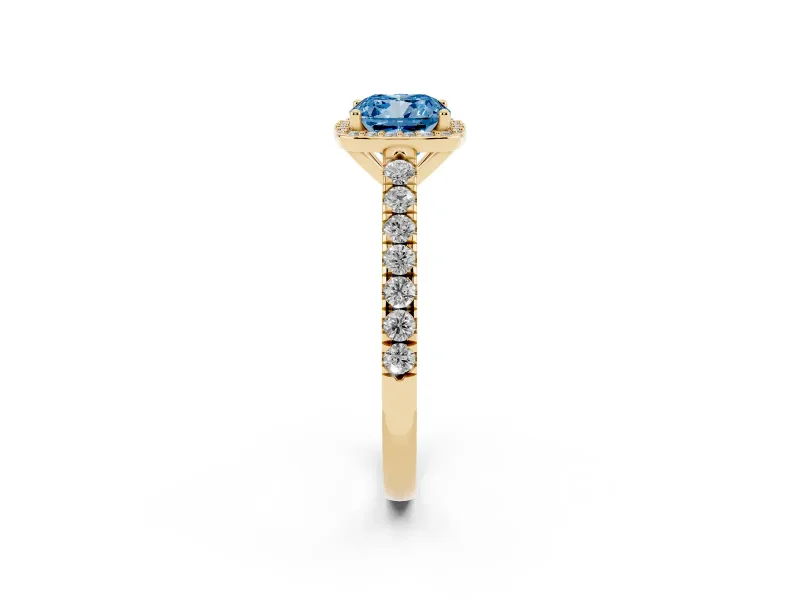 Fancy Blue Cushion Cut Diamond Halo Engagement Ring Set in Yellow gold with Pavé Band and Prong Setting