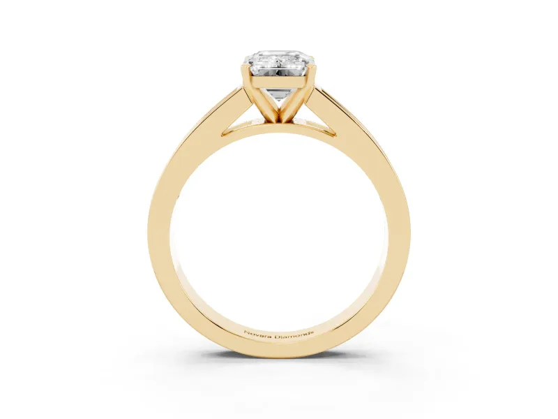 Emerald Cut Diamond Solitaire Ring Set in Yellow gold with Channel-Set Band and Prong Setting