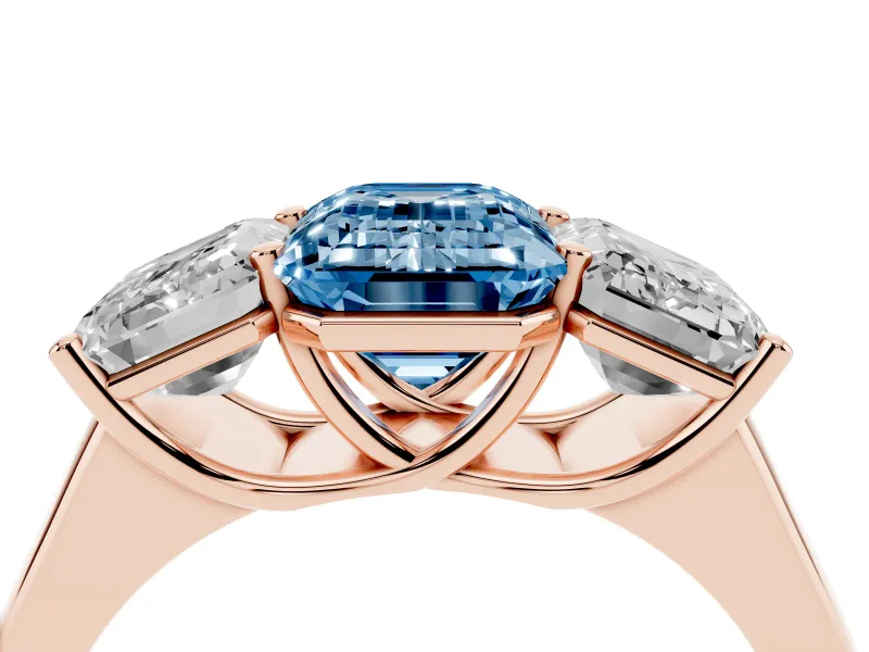 Emerald Cut Three Stone Engagement Ring Setting for a Fancy Blue Lab-Grown Diamond | Basket Prong Heads | Rose Gold