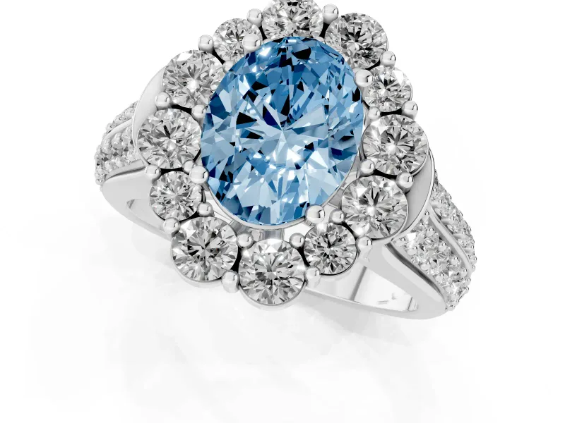 Fancy Blue Oval Cut Diamond Halo Engagement Ring Set in Silver with Split Shank and Prong Setting