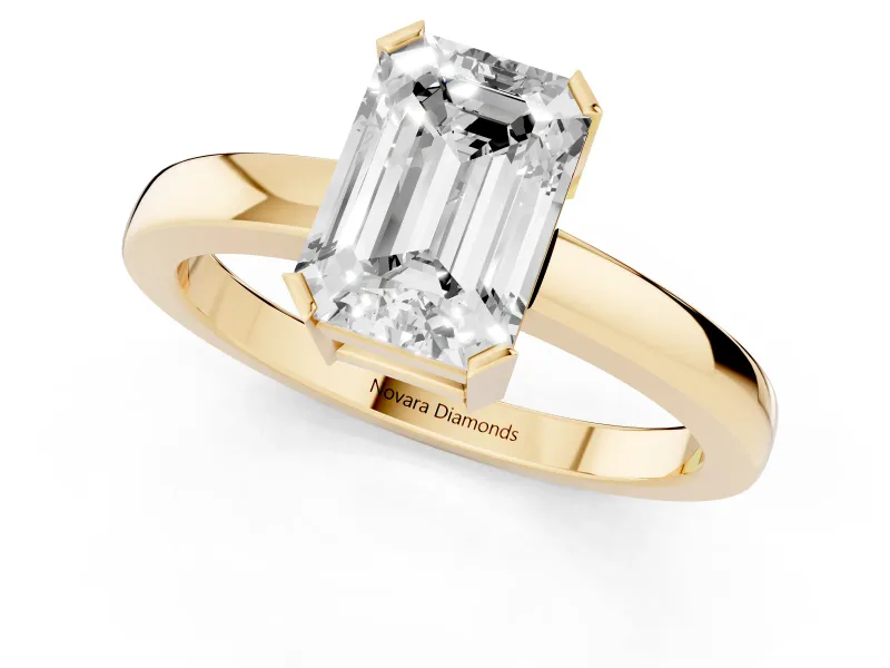 Emerald Cut Diamond Solitaire Ring Set in Yellow gold with Prong Head and Smooth Polished Band