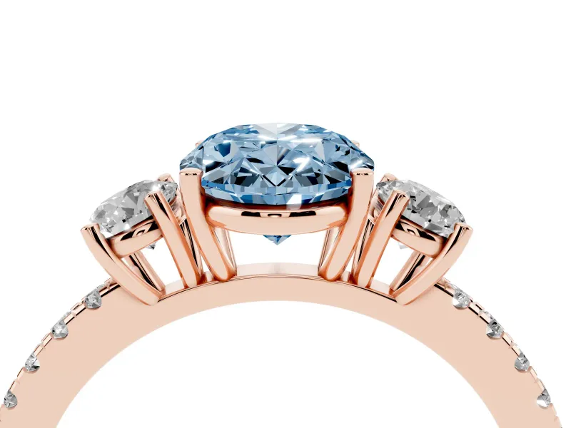 Fancy Blue Oval Cut Diamond Three-Stone Ring Set in Rose gold with Pavé Band and Graduated Sides