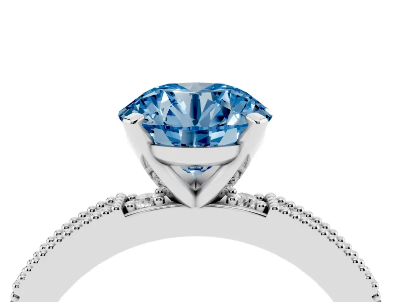 Fancy Blue Round Cut Diamond Solitaire Ring Set in Platinum with Slim Pavé Band and Prong Setting