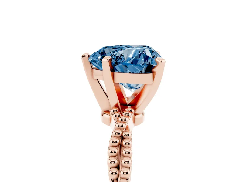 Fancy Blue Heart Cut Diamond Solitaire Ring Set in Rose gold with Twisted Band and Bead Prong Setting