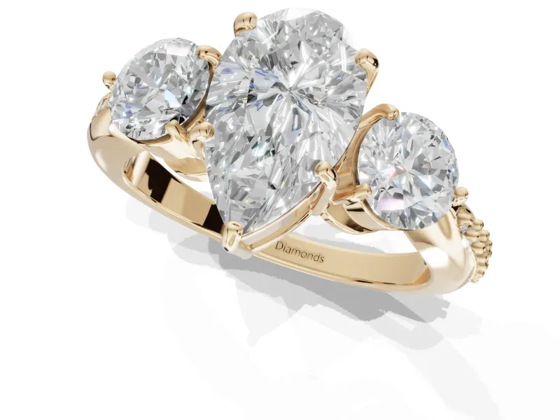 Pear-Shaped Three Stone Engagement Ring Setting | Tapered Pave Band | Yellow Gold