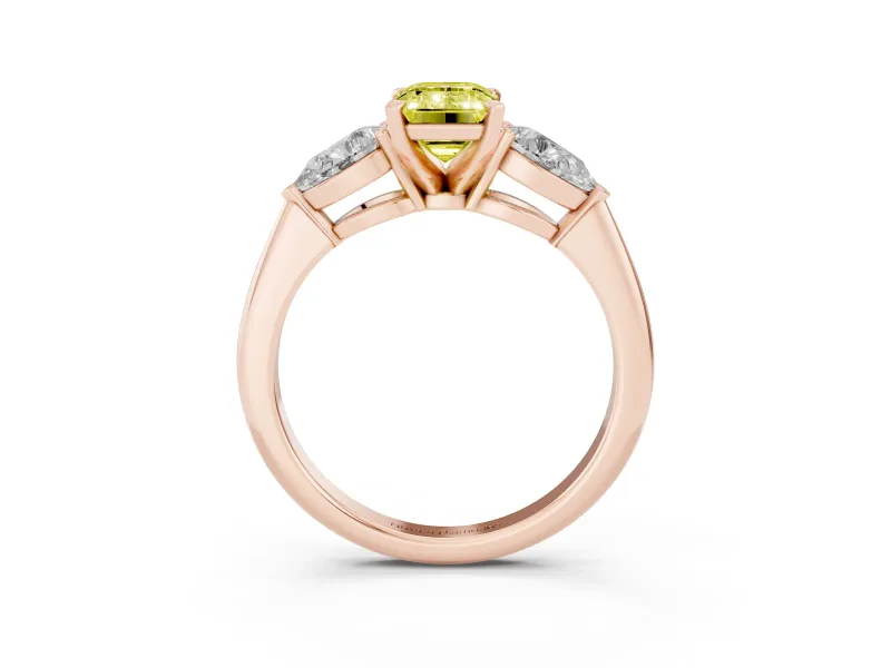 Fancy Yellow Three-Stone Emerald Cut Diamond Ring Set in Rose gold with Pear Side Stones and Prong Setting