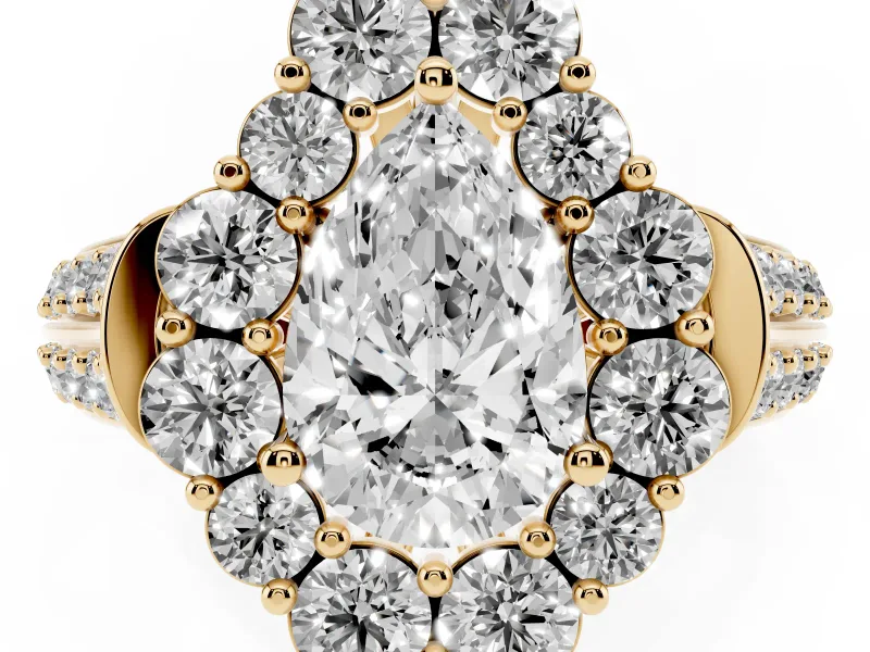 Pear Cut Diamond Halo Engagement Ring Set in Yellow gold with Split Shank and Prong Setting
