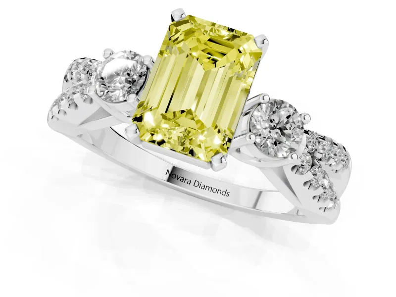 Fancy Yellow Emerald Cut Diamond Three-Stone Ring Set in Platinum with Pavé Split Shank and Prong Setting