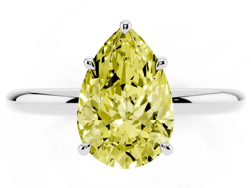 Fancy Yellow Pear Cut Diamond Solitaire Ring Set in Silver with Thin Band and Prong Setting