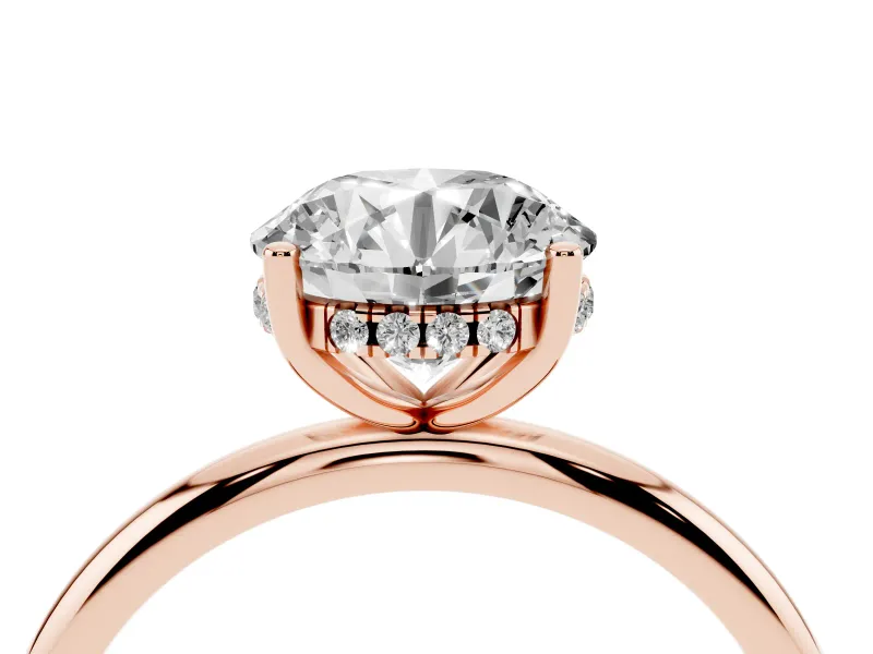 Round Cut Diamond Solitaire Engagement Ring Set in Rose gold with Prong Setting and Polished Band