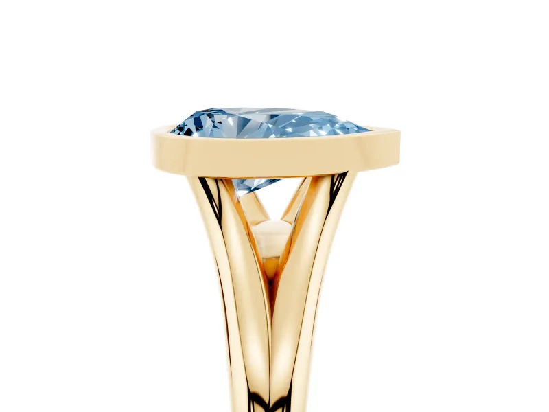 Fancy Blue Bezel Set Pear Cut Diamond Solitaire Ring Set in Yellow gold with Tapered Band