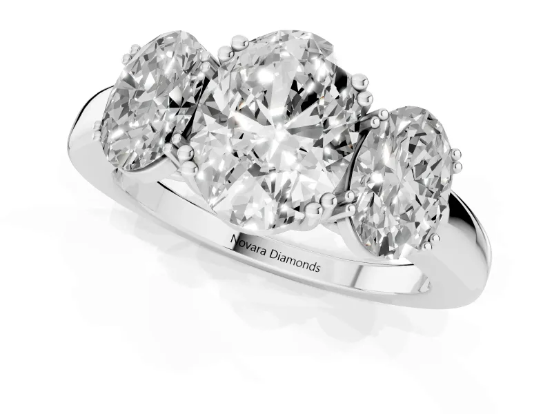 Oval Cut Diamond Three-Stone Ring Set in White gold with Polished Band and Prong Setting