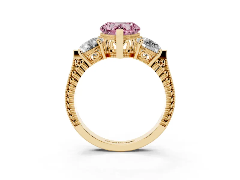 Fancy Pink Heart Cut Diamond Three-Stone Ring Set in Yellow gold with Milgrain Band