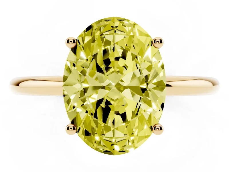 Fancy Yellow Oval Cut Diamond Solitaire Engagement Ring Set in Yellow gold with Thin Band and Prong Setting