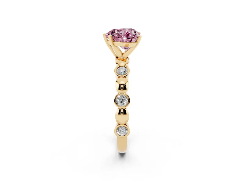 Fancy Pink Heart Cut Diamond Solitaire Ring Set in Yellow gold with Bezel-Set Accents on Beaded Band and Prong Setting