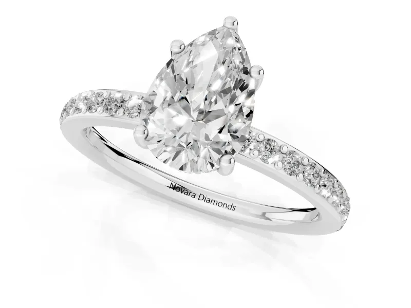 Pear Cut Diamond Pavé Band Ring Set in Platinum with Prong-Set Center Stone