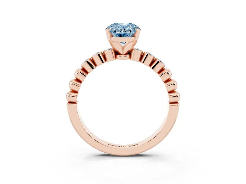 Fancy Blue Oval Cut Diamond Solitaire Engagement Ring Set in Rose gold with Bezel Accents on Beaded Band