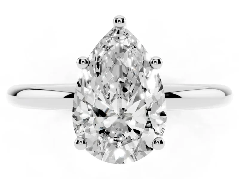 Pear Cut Diamond Solitaire Engagement Ring Set in Silver with Prong Setting and Polished Band