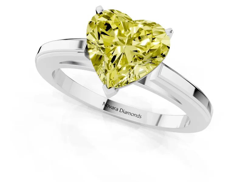 Fancy Yellow Heart Cut Diamond Solitaire Ring Set in Platinum with Prong Setting and Classic Band