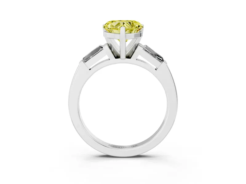 Fancy Yellow Heart Cut Diamond Solitaire Ring Set in White gold with Tapered Baguette Side Stones and Prong Setting