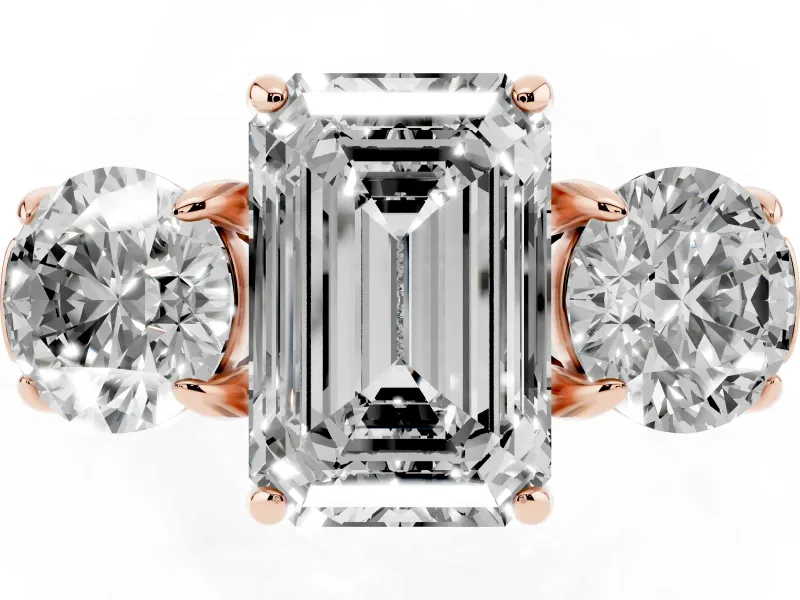 Emerald Cut Diamond Three-Stone Ring Set in Rose gold with Round Accent Stones and Plain Band