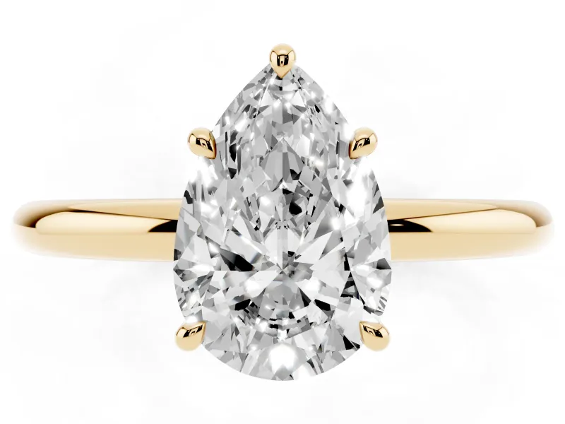 Pear Cut Diamond Solitaire Ring Set in Yellow gold with Thin Band and Prong Setting