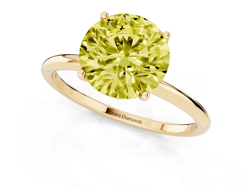 Fancy Yellow Round Cut Diamond Solitaire Engagement Ring Set in Yellow gold with Thin Band and Prong Setting