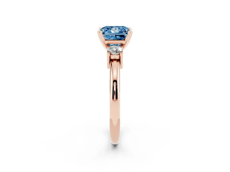 Fancy Blue Three-Stone Princess Cut Diamond Ring Set in Rose gold with Prong Setting and Plain Band