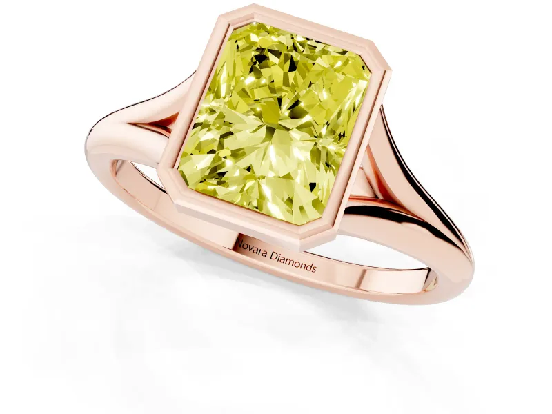 Fancy Yellow Bezel Set Radiant Cut Diamond Solitaire Ring Set in Rose gold with Tapered Band
