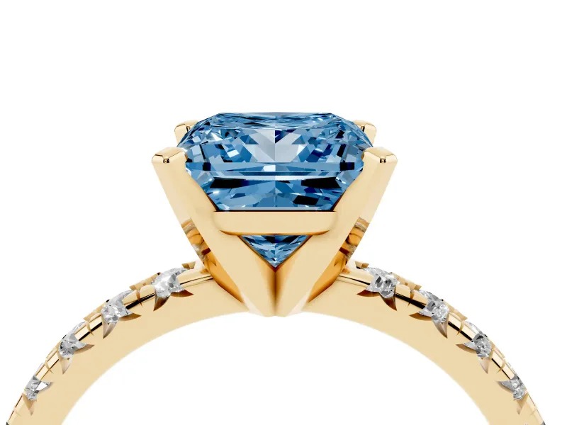 Fancy Blue Princess Cut Diamond Solitaire Pavé Engagement Ring Set in Yellow gold with Round Band and Prong Setting