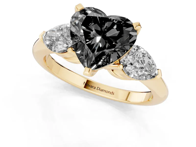 Fancy Black Three-Stone Heart Cut Diamond Ring Set in Yellow gold with Pear Side Stones and Prong Setting