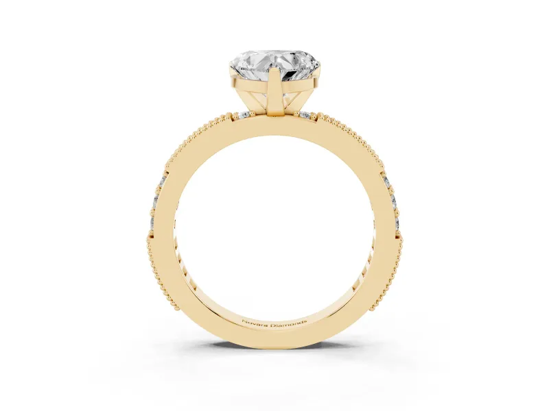 Heart Cut Diamond Solitaire Ring Set in Yellow gold with Slim Pavé Band and Prong Setting
