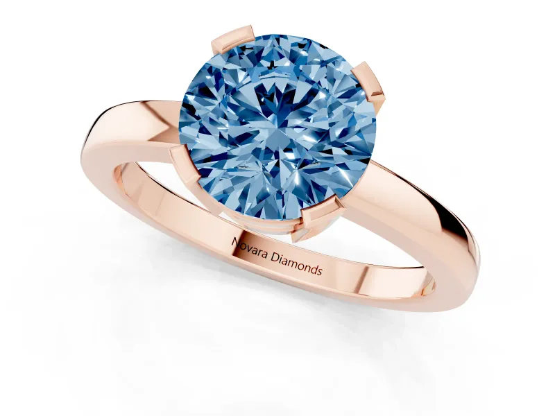 Fancy Blue Round Cut Diamond Solitaire Ring Set in Rose gold with Prong Head and Smooth Polished Band