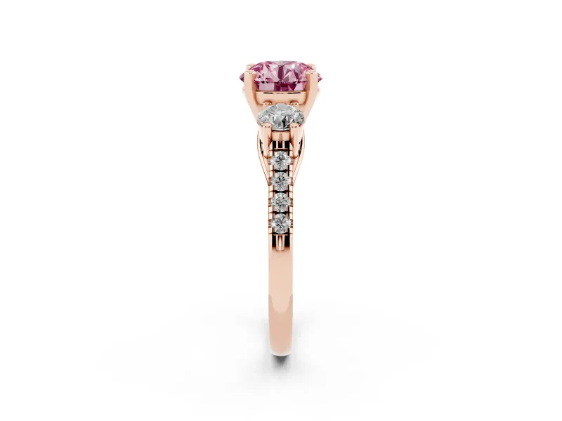 Fancy Pink Three-Stone Round Cut Diamond Pavé Band Ring Set in Rose gold with Prong-Set Trio