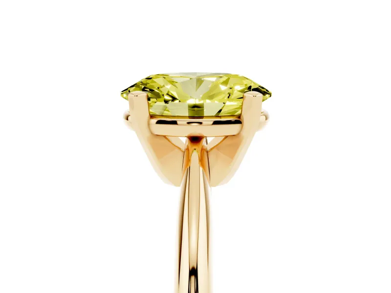 Fancy Yellow Oval Cut Diamond Solitaire Ring Set in Yellow gold with Prong Setting on a Plain Round Band