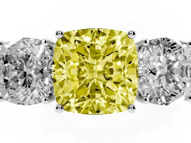 Fancy Yellow Cushion Cut Diamond Three-Stone Ring Set in White gold with Textured Band