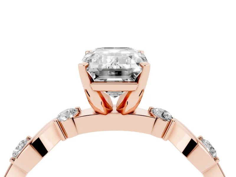 Emerald Cut Diamond Solitaire Ring Set in Rose gold with Ribbon Twist Band, Round Accents and Prong Setting
