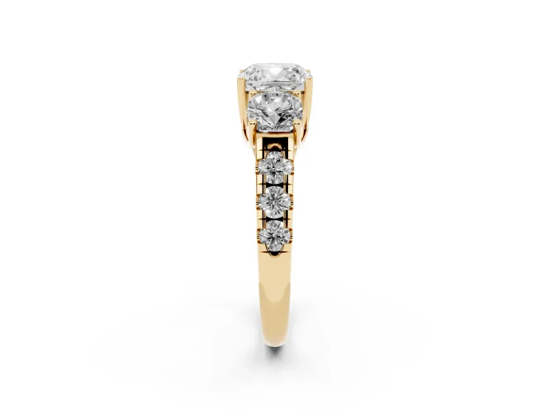 Cushion Cut Diamond Three-Stone Ring Set in Yellow gold with Pavé Band
