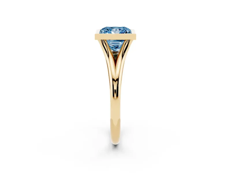 Fancy Blue Bezel Set Princess Cut Diamond Solitaire Ring Set in Yellow gold with Tapered Band