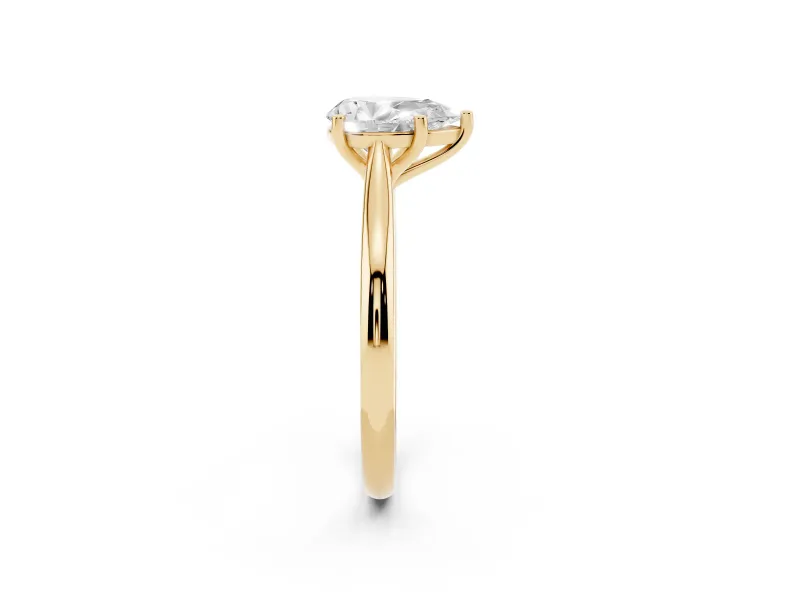 Pear Cut Diamond Solitaire Ring Set in Yellow gold with Cathedral Band and Prong Setting