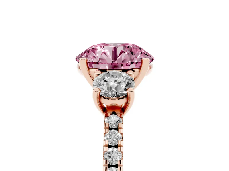 Fancy Pink Round Cut Diamond Three-Stone Ring Set in Rose gold with Pavé Band and Graduated Sides
