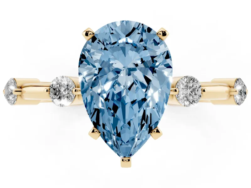 Fancy Blue Pear Cut Diamond Solitaire Ring Set in Yellow gold with Bezel Set Side Stones and Prong Setting