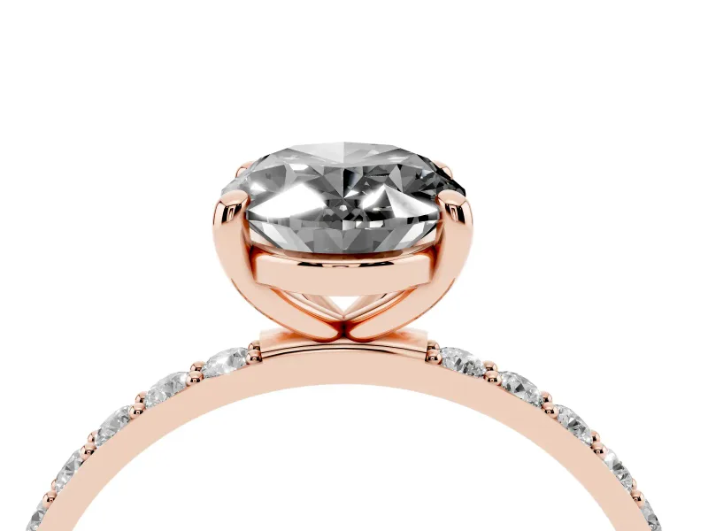 Fancy Black Oval Cut Diamond Solitaire Ring Set in Rose gold with Round Pavé Band and Prong Setting