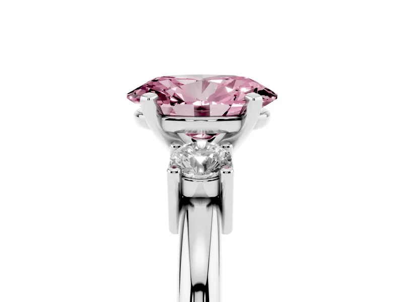 Fancy Pink Three-Stone Oval Cut Diamond Ring Set in White gold with Prong Setting and Plain Band