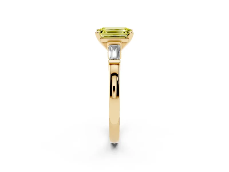 Fancy Yellow Emerald Cut Diamond Solitaire Ring Set in Yellow gold with Tapered Baguette Accents and Prong Setting