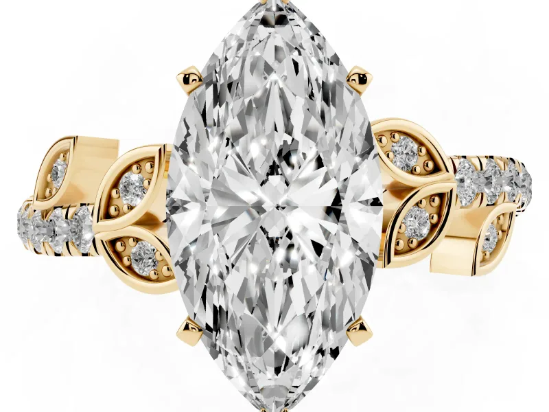 Marquise Cut Diamond Solitaire Leaf-Inspired Ring Set in Yellow gold with Pavé Band and Prong Setting